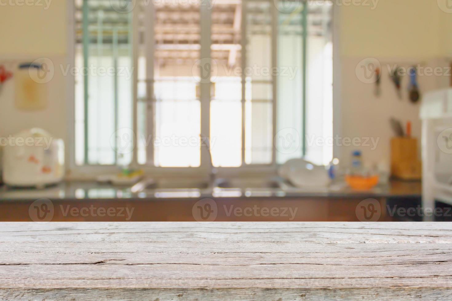 Wood table on kitchen sink interior background photo