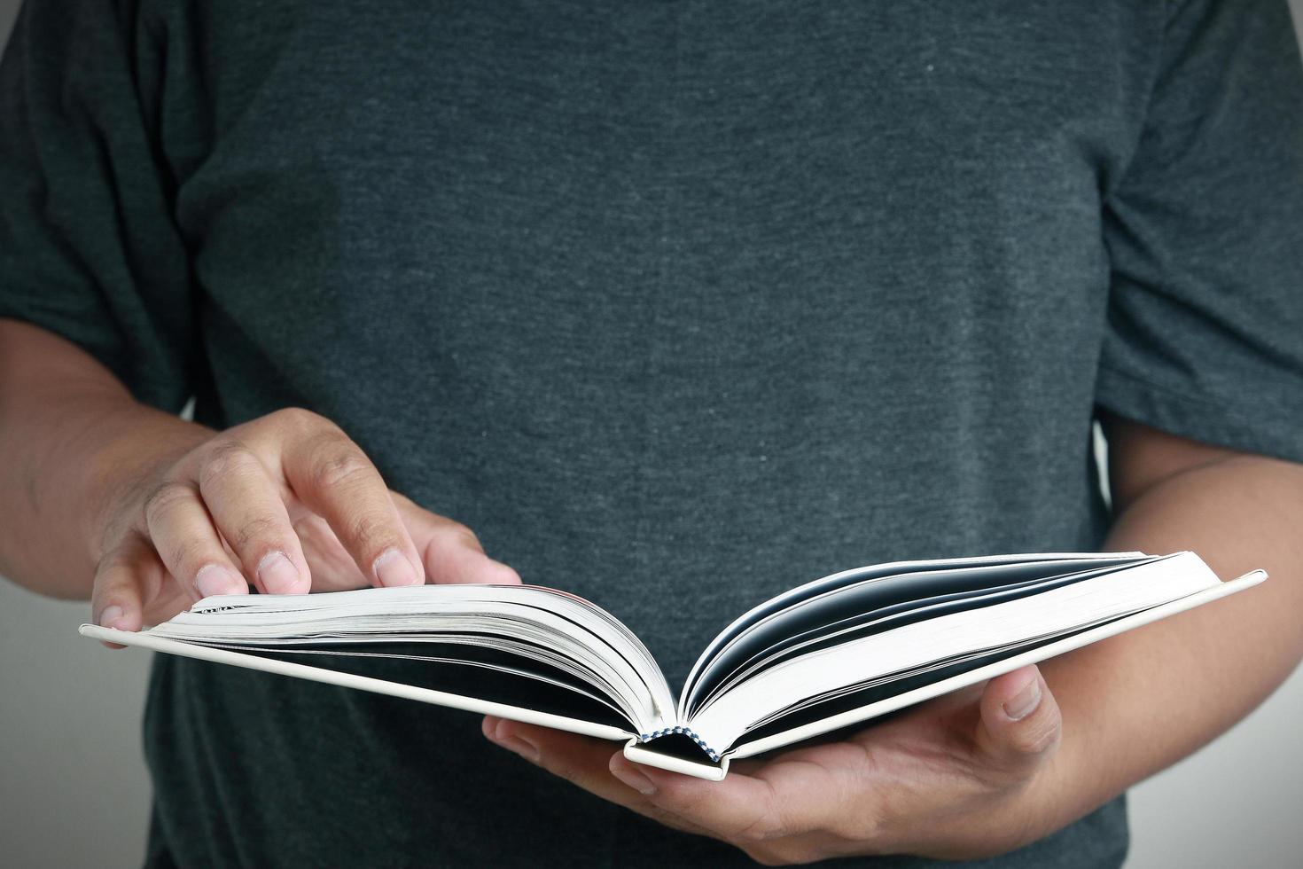 Men holding a white book photo