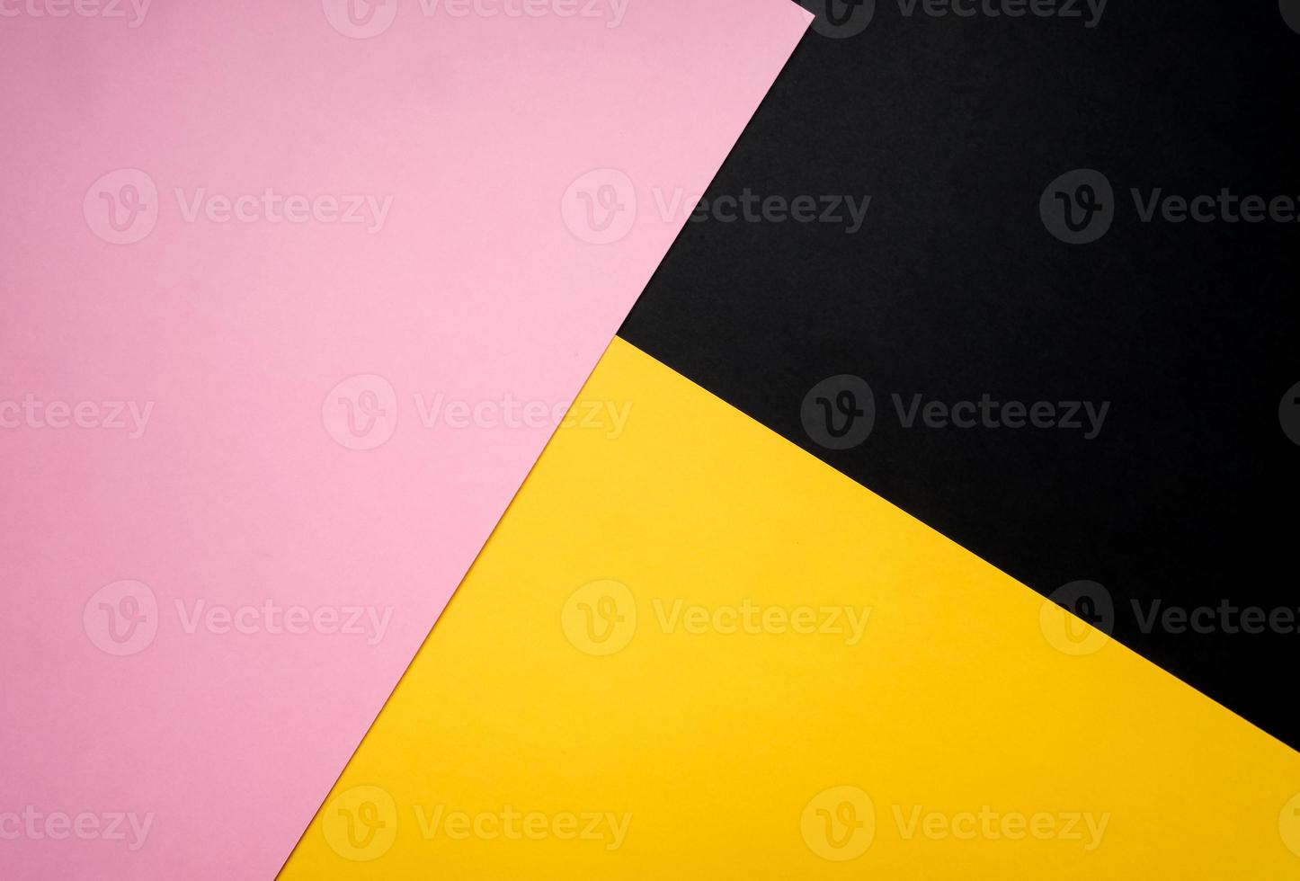 Minimalist concept, abstract colored paper geometry background, flat lay top view, multicolored empty image with copy space for any design purposes, bright yellow, bright pink, simple black photo