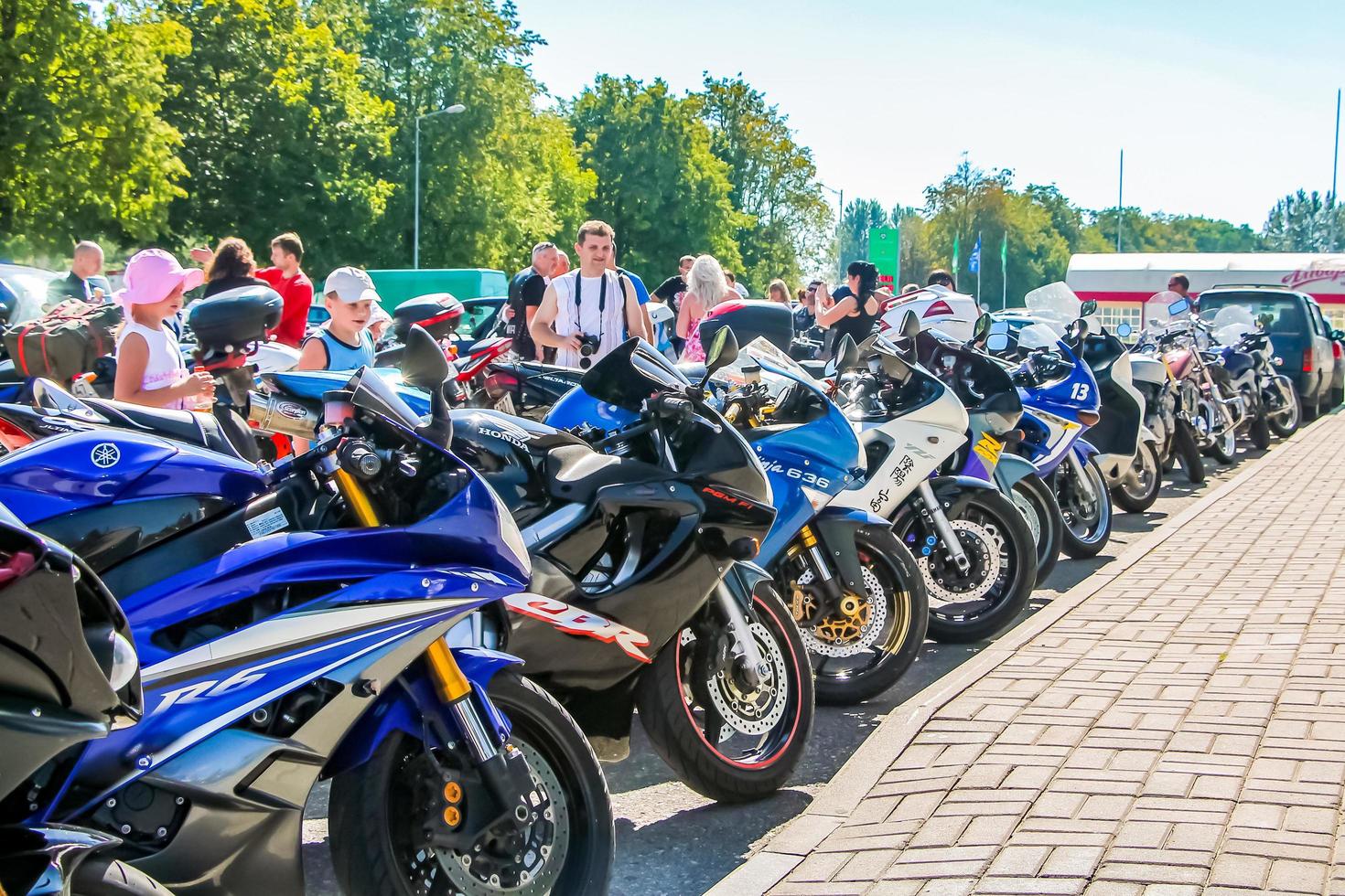 Parade of motorcycles in city on summer sunny day. Exhibition in open air. photo