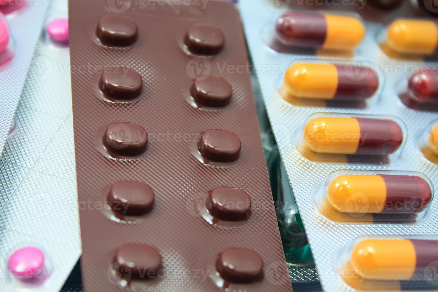 packings of medicine pills and capsules photo
