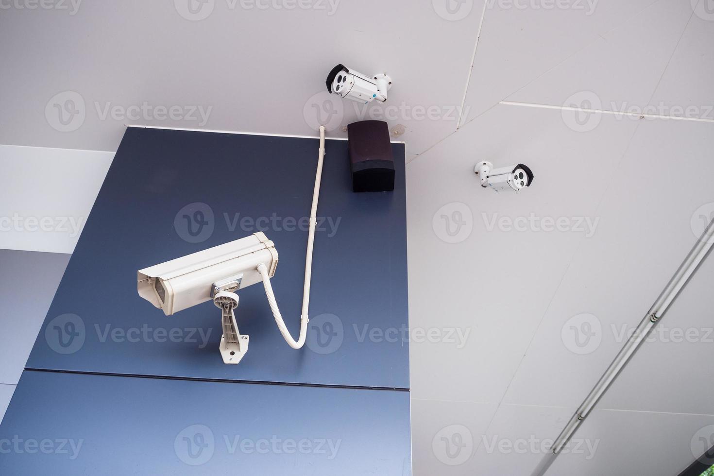 Security CCTV camera on the wall photo