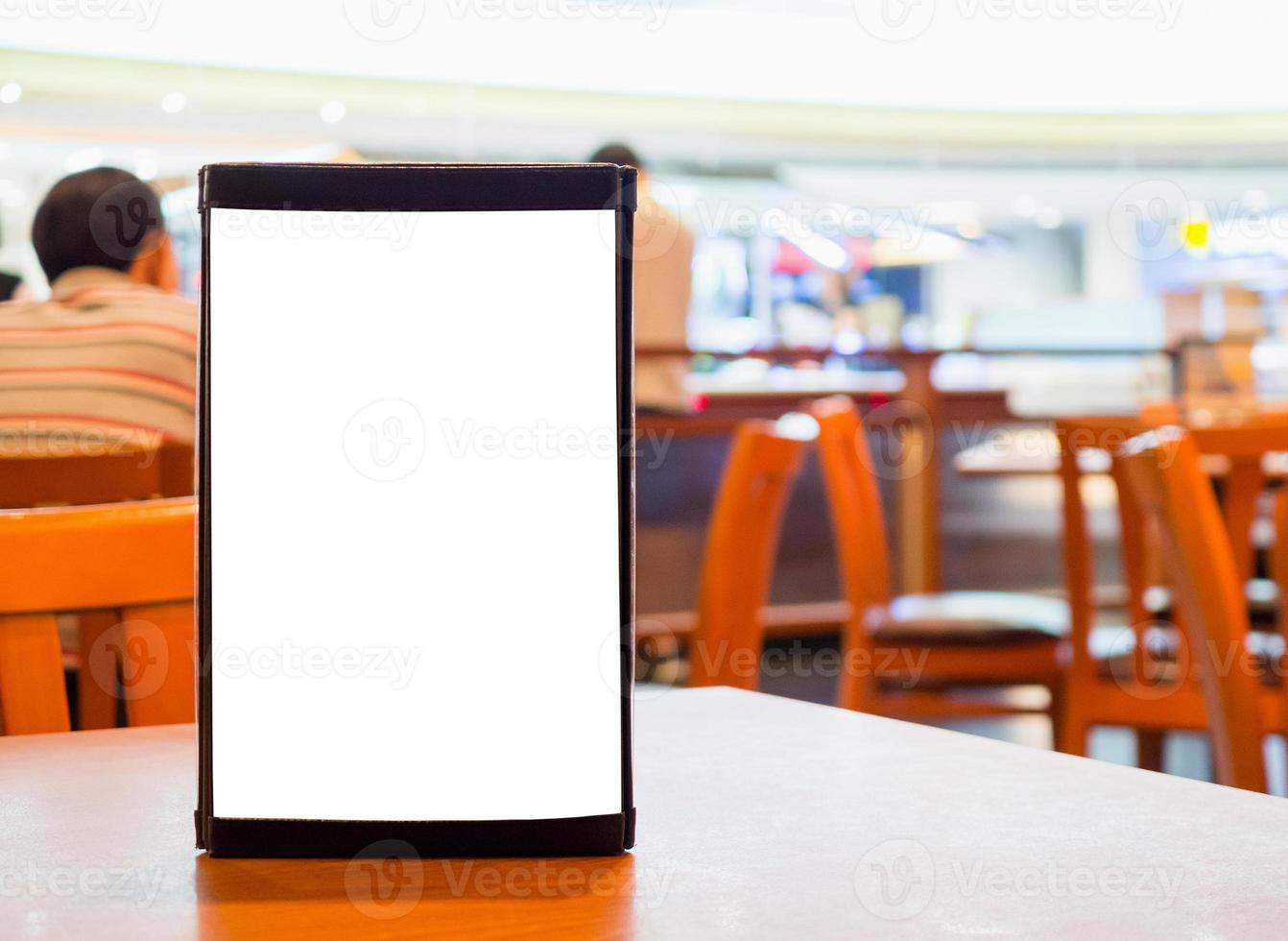 Mock up Blank white menu frame on cafe restaurant table photo