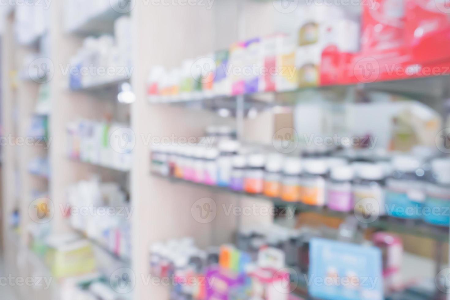 pharmacy store interior with medicine on medical shelves blur background photo