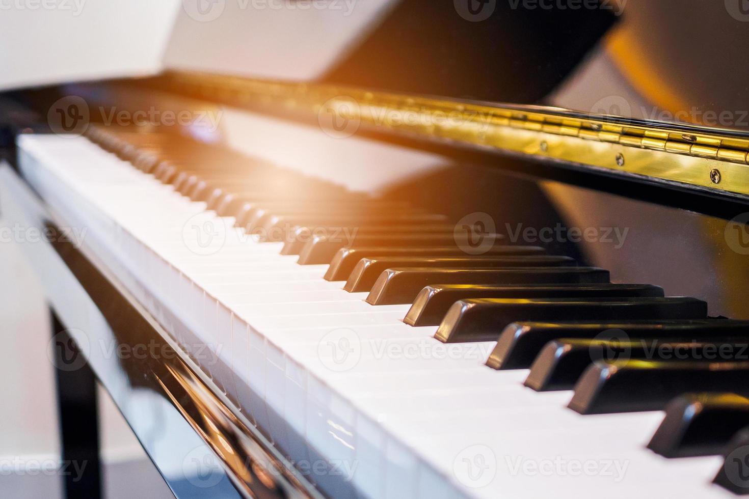 Close up musician hand playing piano photo