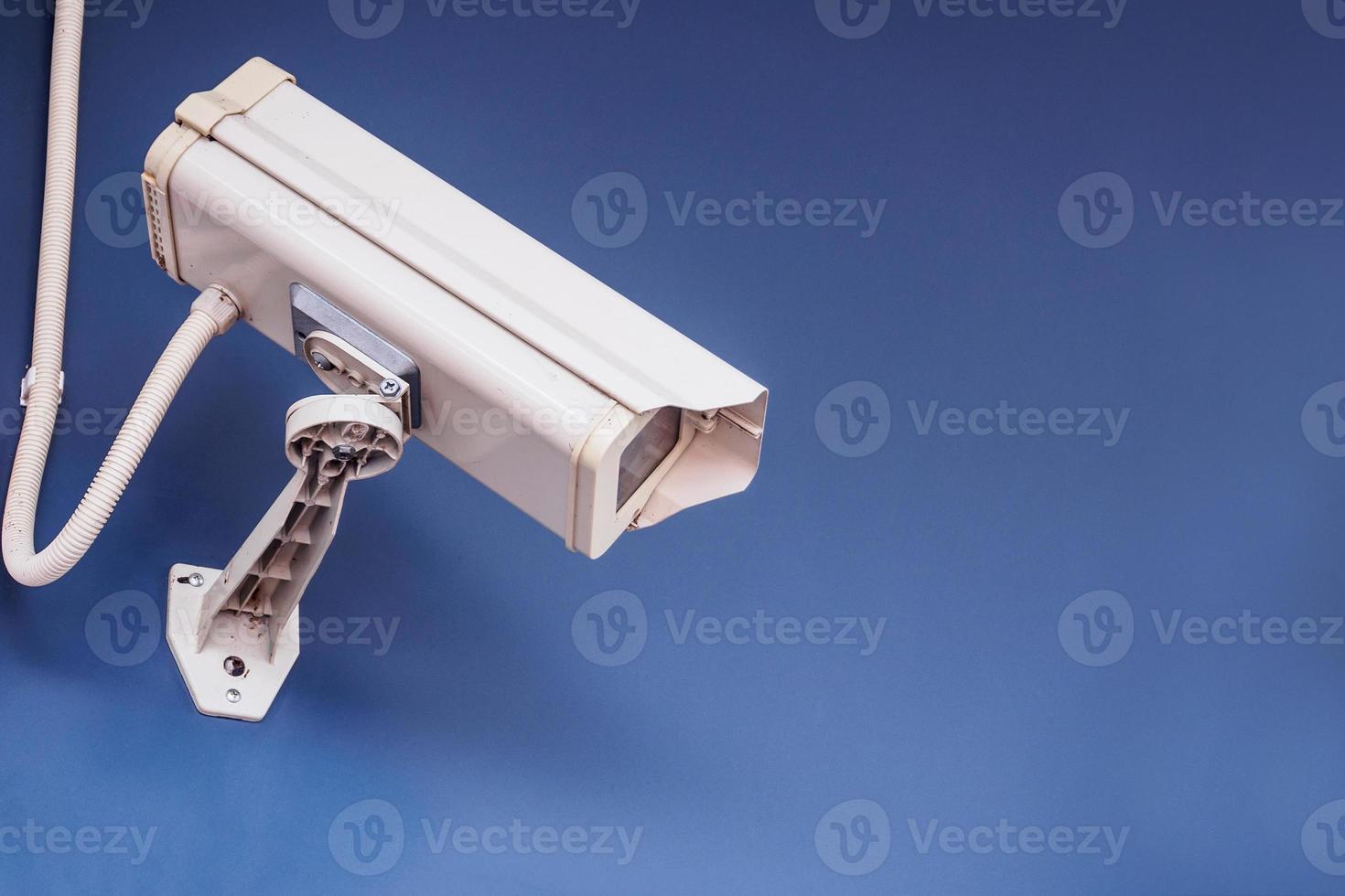 Security CCTV camera on the wall photo