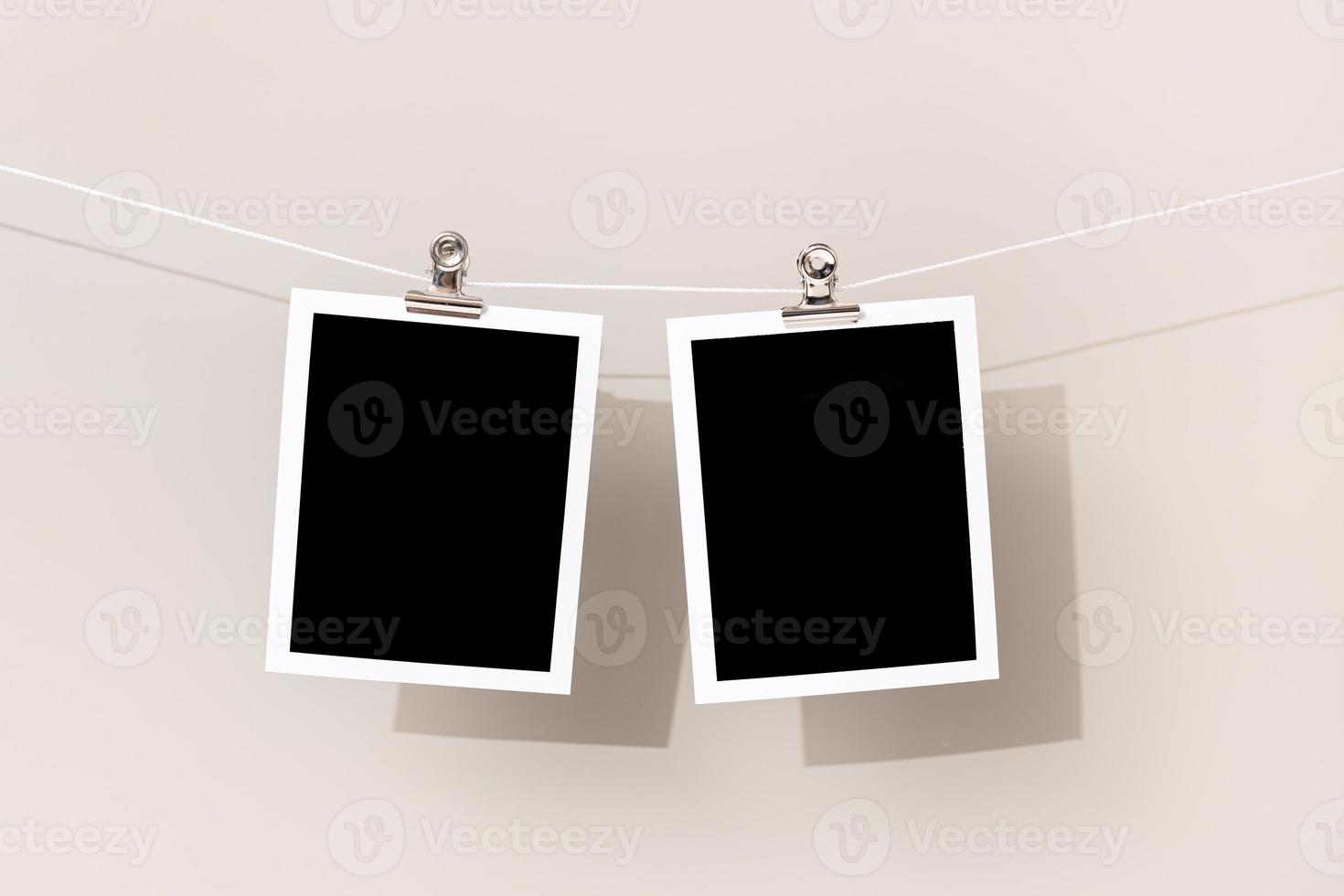 Two Blank Vintage instant photo frame hanging on a rope