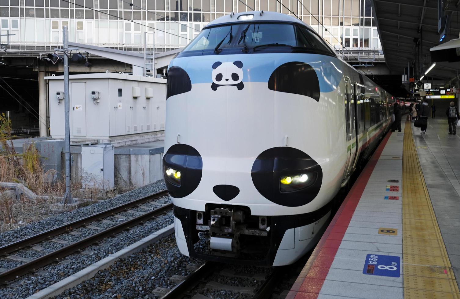 Tokyo, Japan - January 3, 2023 - The amusing panda-themed Kuroshio Express train runs as Panda Kuroshio Panda Kuroshio at a train station. photo