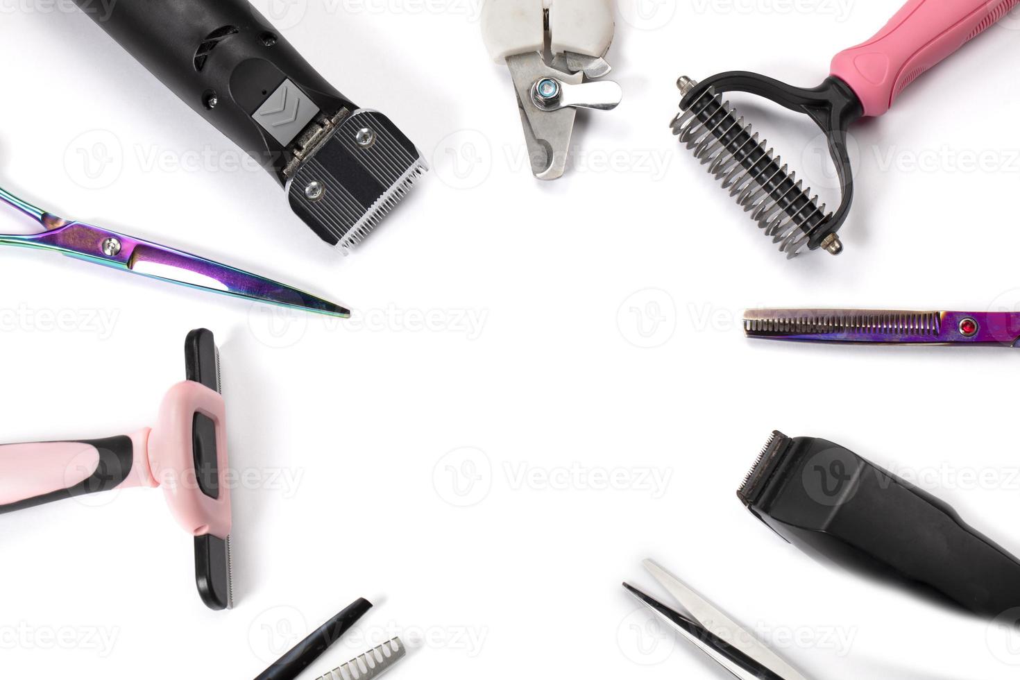 Tool for the groomer on a white background. Dog grooming accessories. Scissors for cutting animals. View from above photo