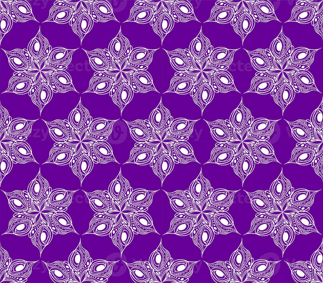 seamless symmetrical pattern of abstract white graphic elements on a purple background, texture, design photo