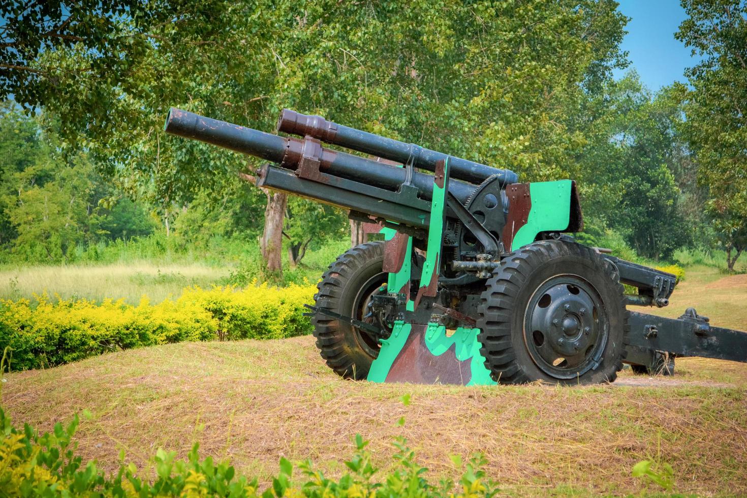 Old artillery cannon gun camouflage pattern ordnance for soldier warrior in the world war in the park photo
