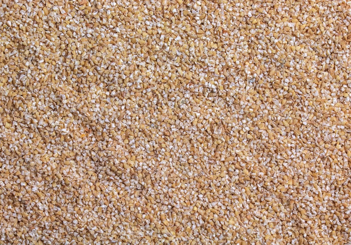 Background of raw wheat groats. Texture. Flat lay. Healthy food concept. photo