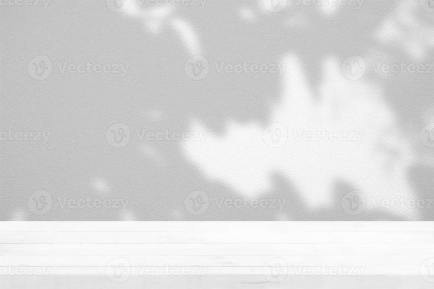 White Wood Table with Tree Shadow on Concrete Wall Texture Background, Suitable for Product Presentation Backdrop, Display, and Mock up. photo
