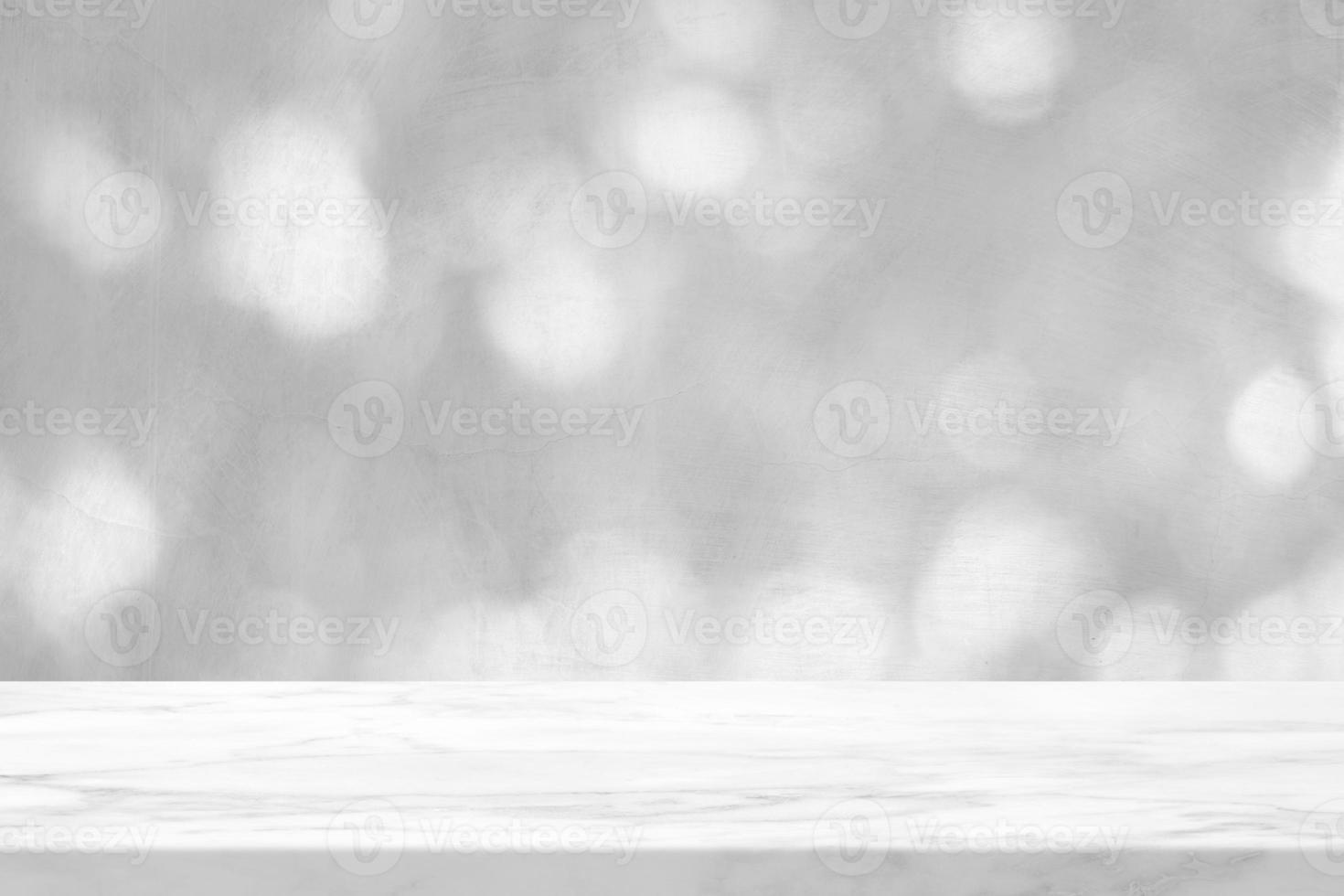 Empty Marble Table with White Bokeh on Concrete Wall Background for Product Presentation. photo