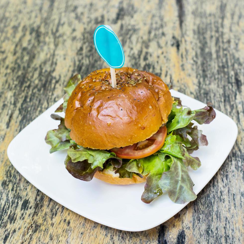 close up hamburger food on wood table photo