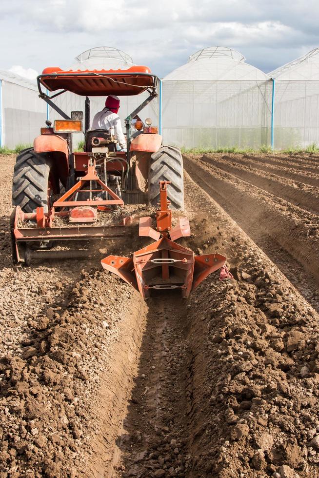 tractor preparation soil working in field agriculture. photo