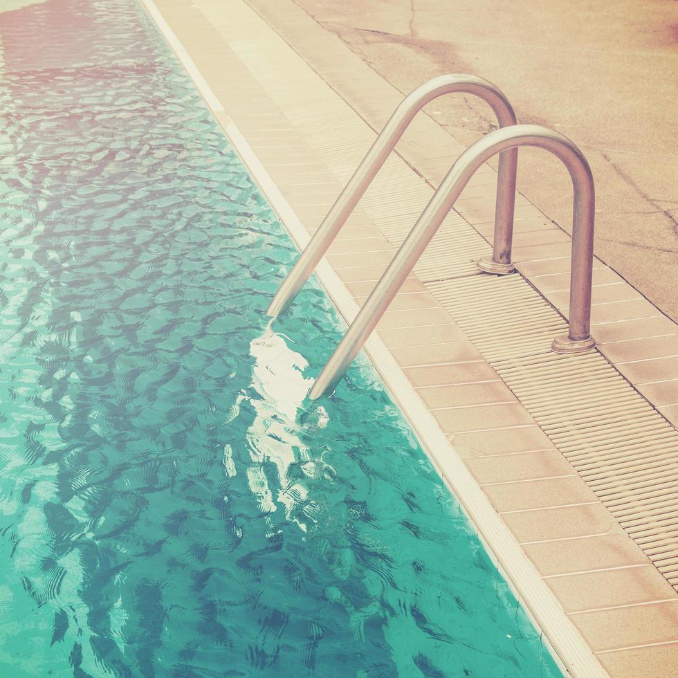 Swimming pool with stairs with vintage effect. photo