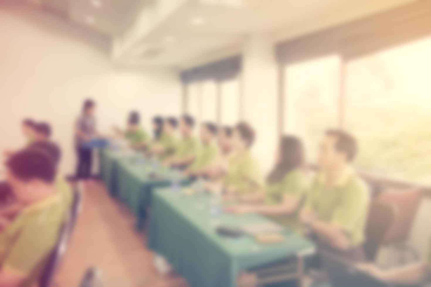 Abstract blurred people in seminar room with vintage effect. photo