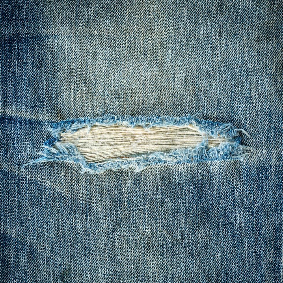 Close up jeans torn background and texture photo