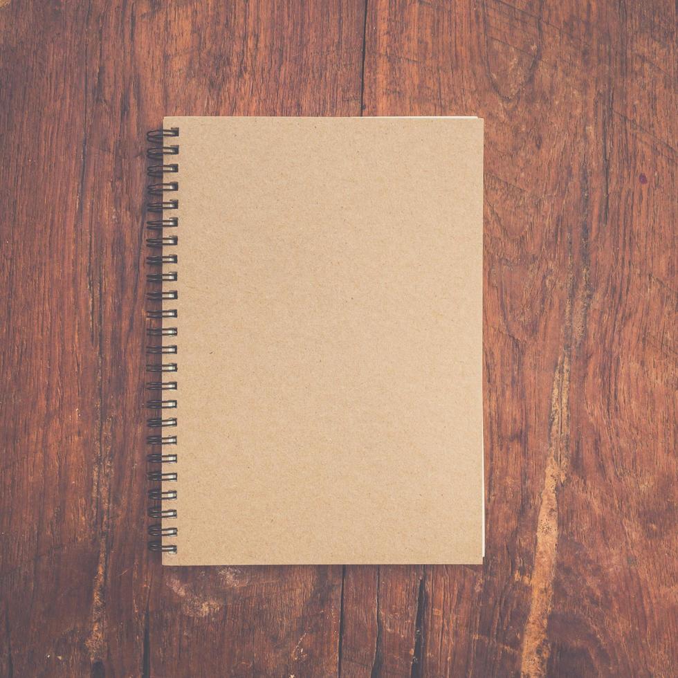 brown book paper on wood table. photo