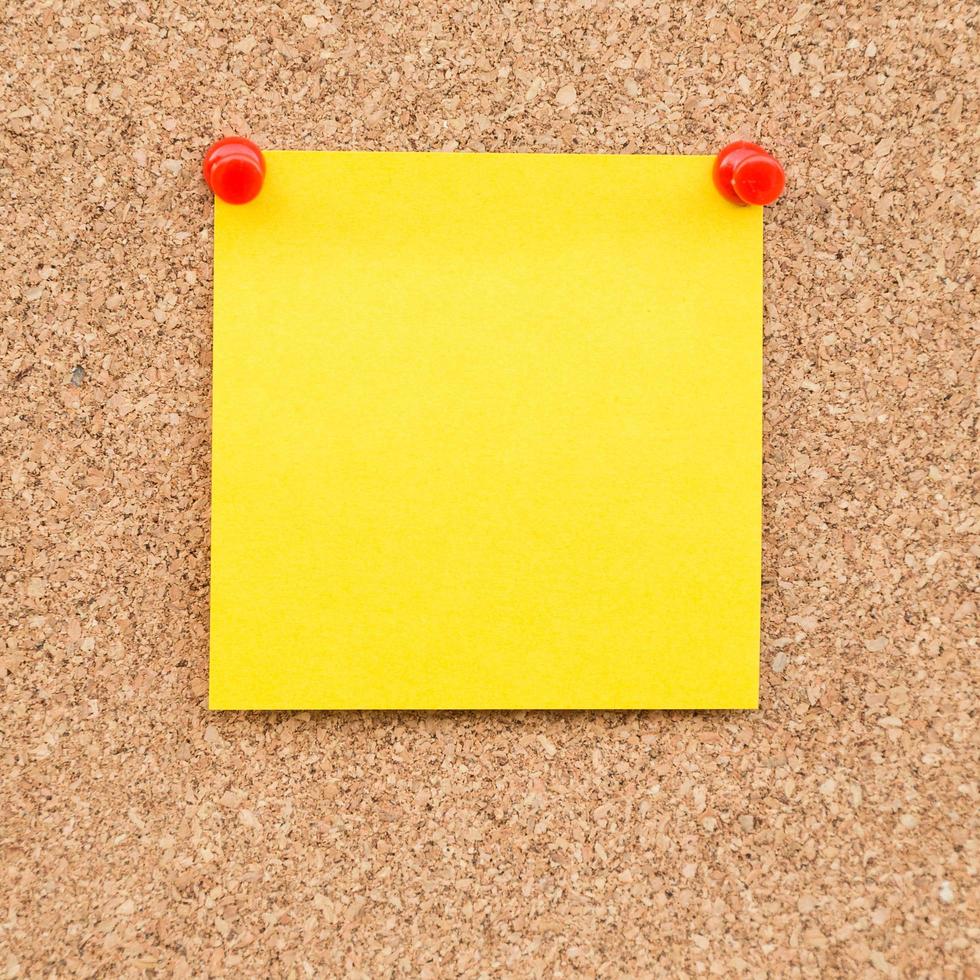 Sticky yellow blank note with space for text. photo