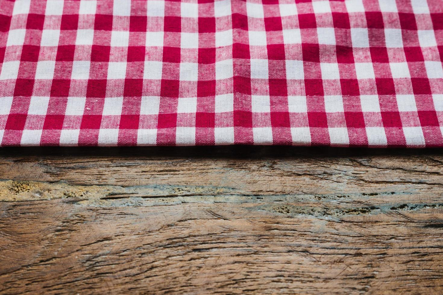 red fabric tablecloth textile on wooden background photo
