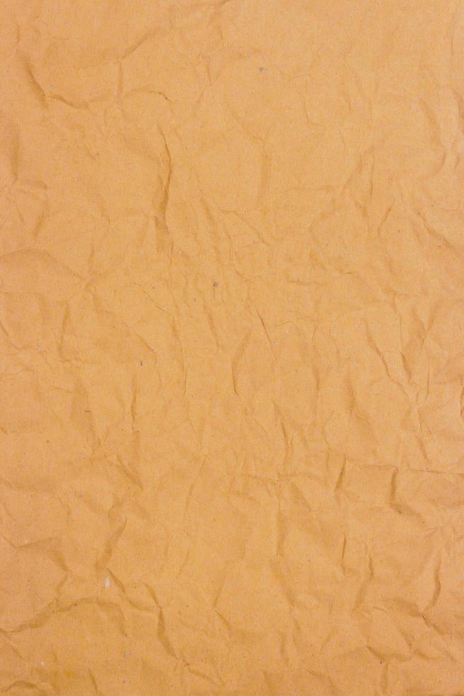 Crumpled bronw paper background texture photo
