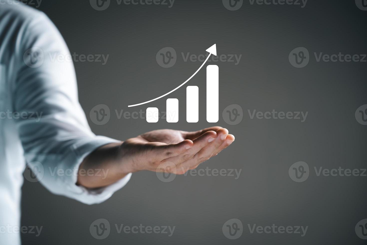 Businessman holding virtual graph, graph analysis of business growth and investment, strategic planning to increase sales profits, long-term business plan. photo