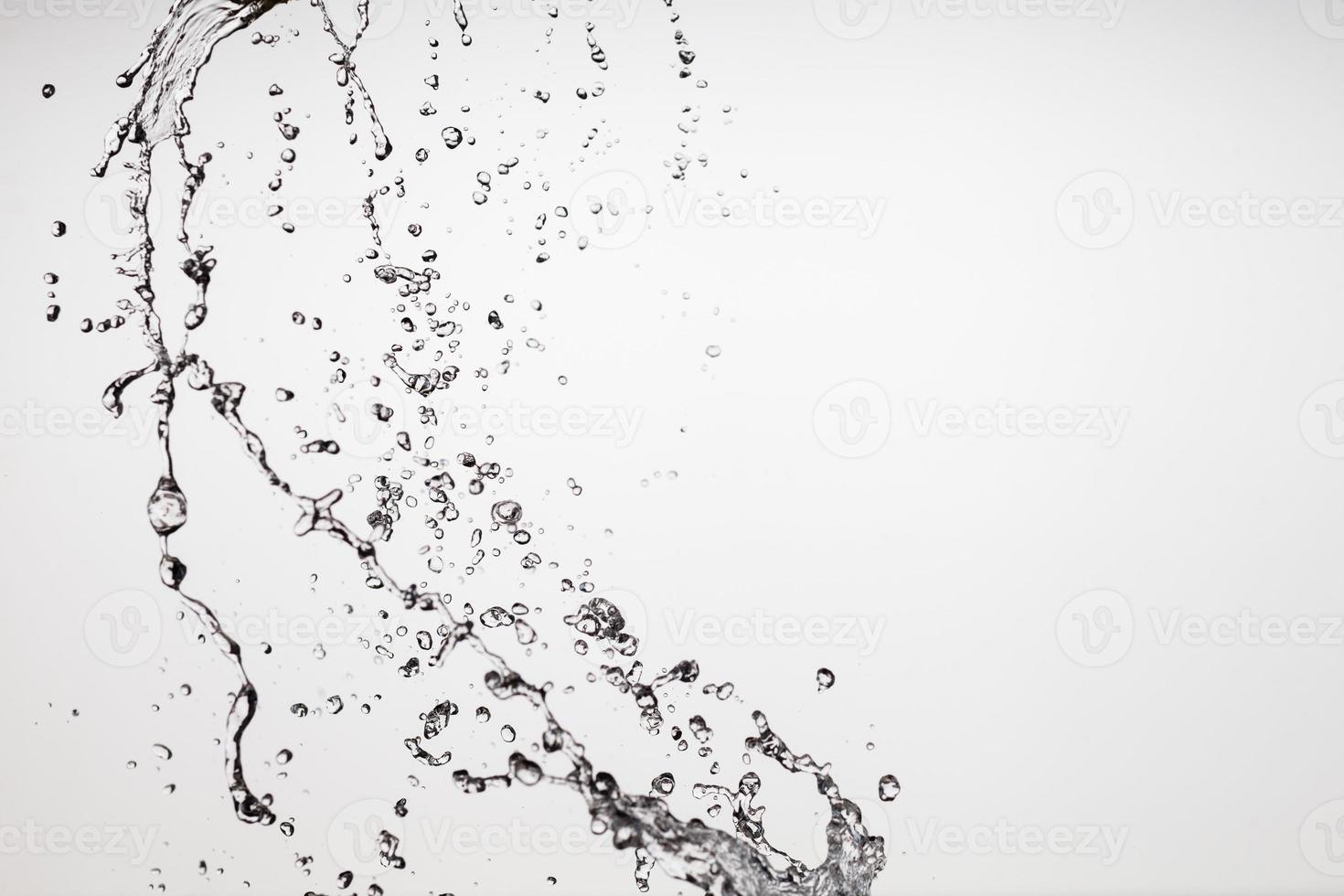 Falling water on a white background photo