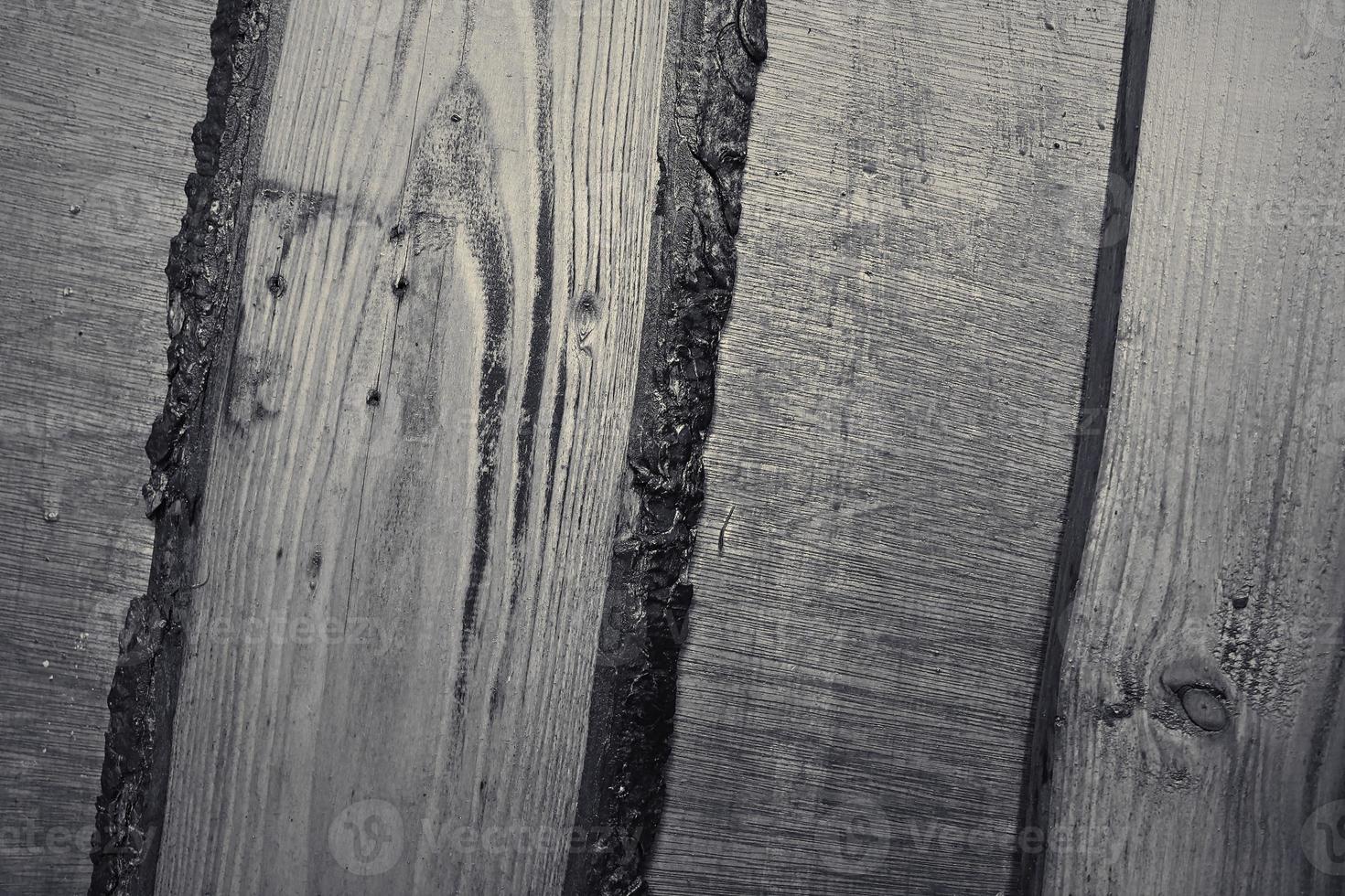 Wooden surface showing planks and grain textures in high resolution. photo