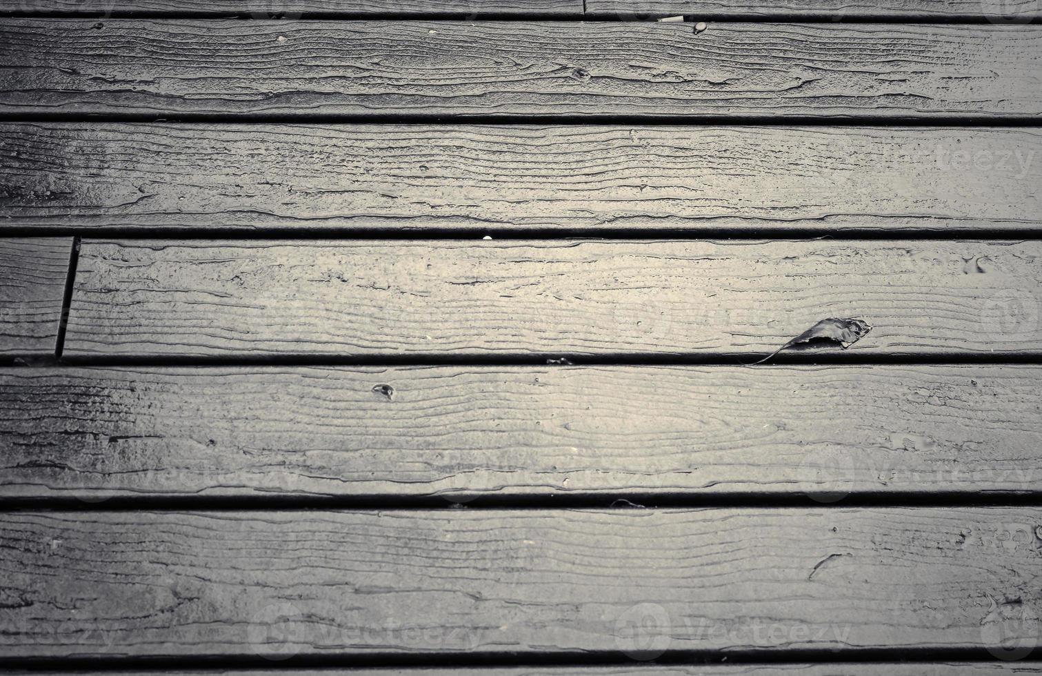 Wooden surface showing planks and grain textures in high resolution. photo