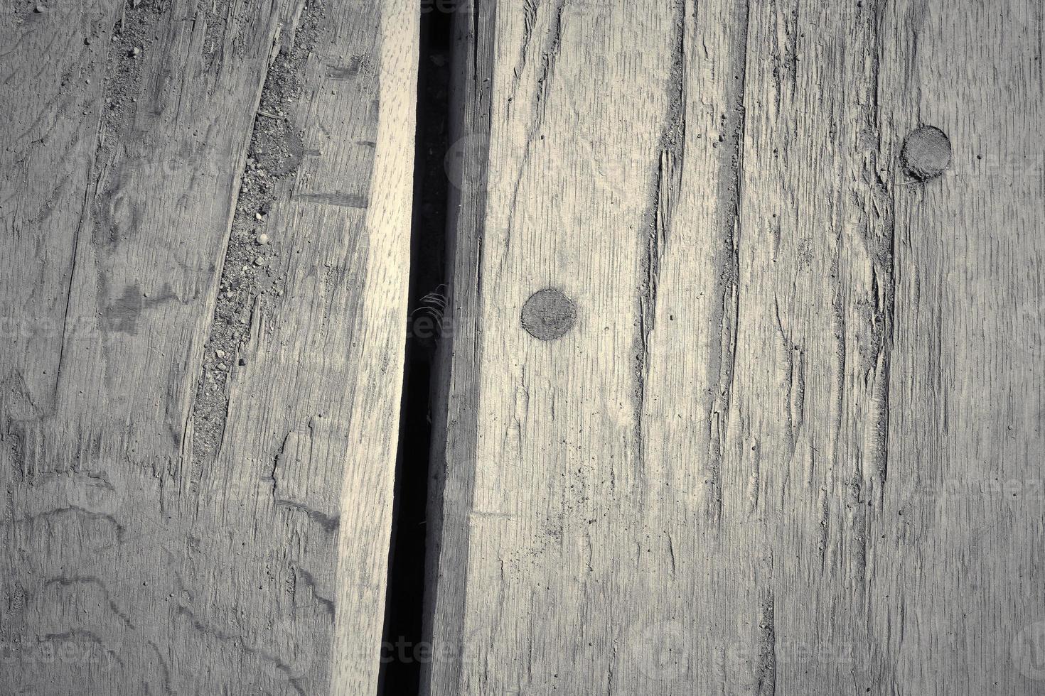 Wooden surface showing planks and grain textures in high resolution. photo