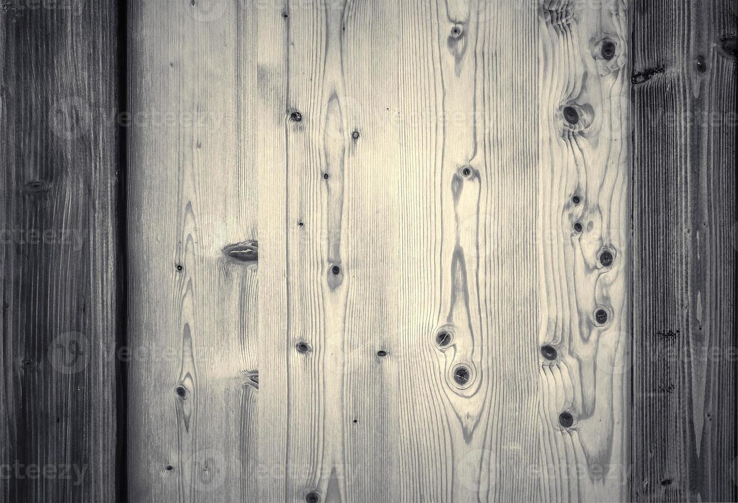Wooden surface showing planks and grain textures in high resolution. photo