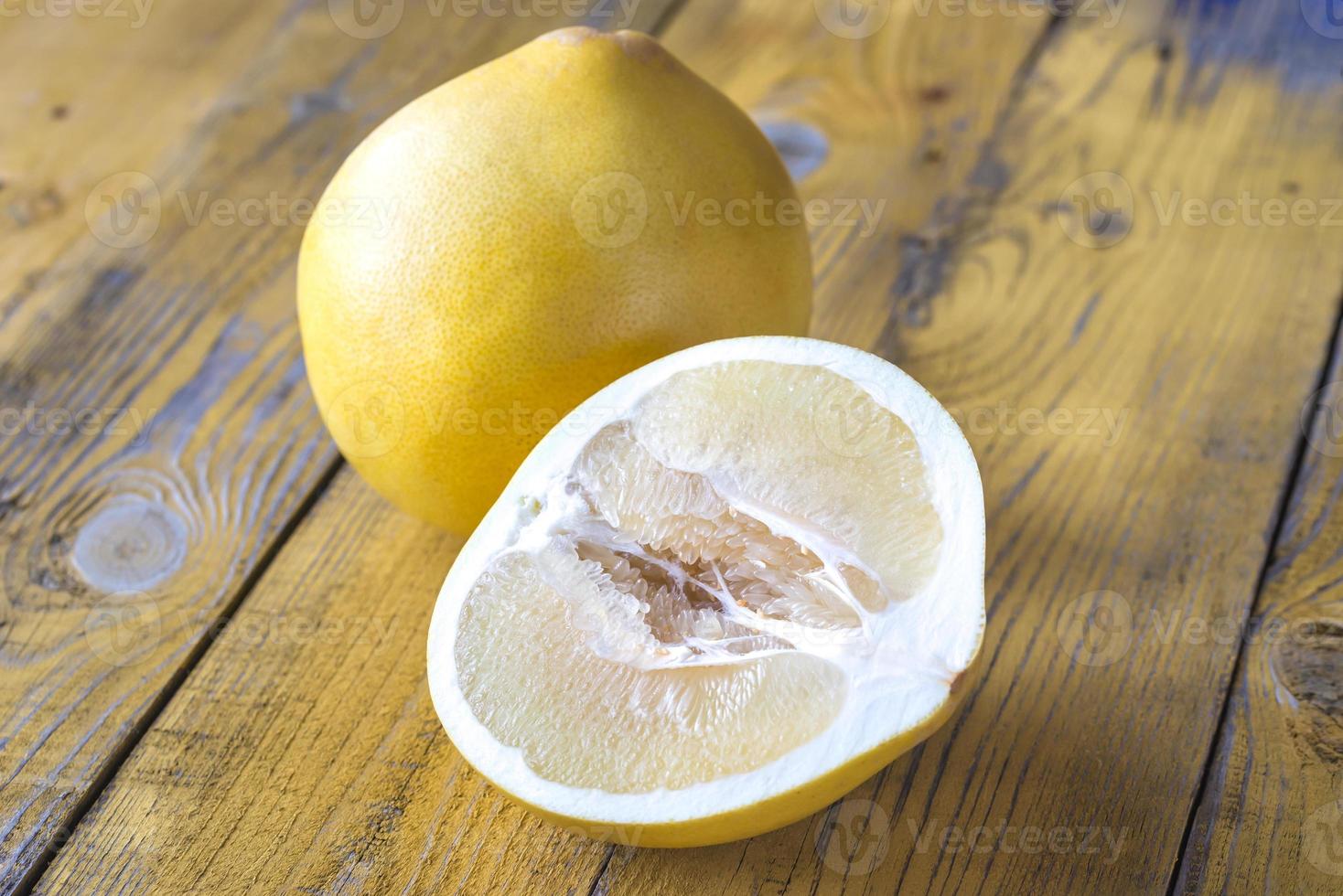 Pomelo on the wooden table photo