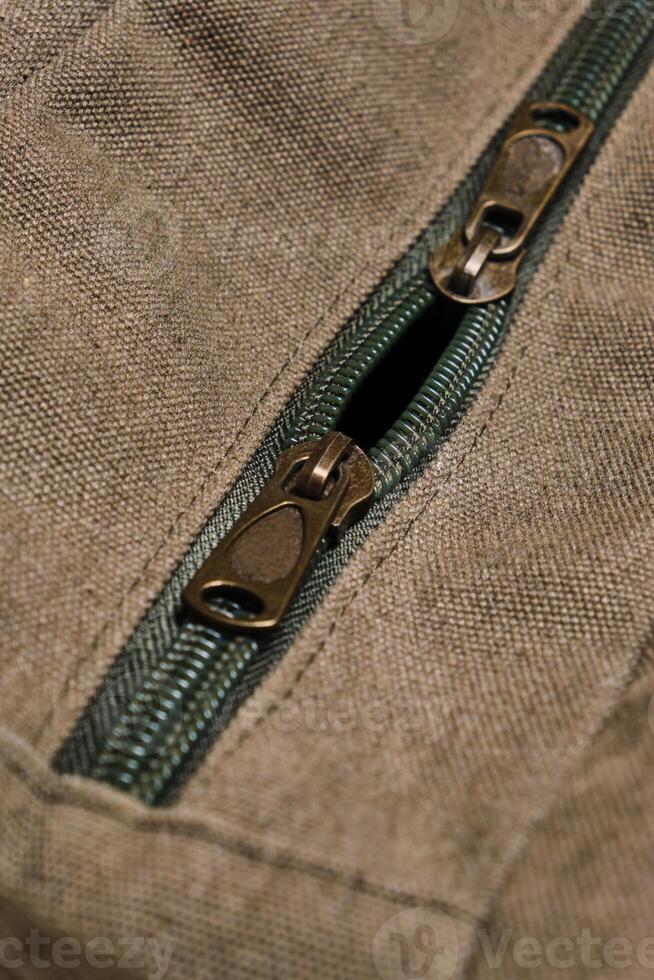 Unbuttoned zipper with two dogs on hiking backpack. 19896257 Stock