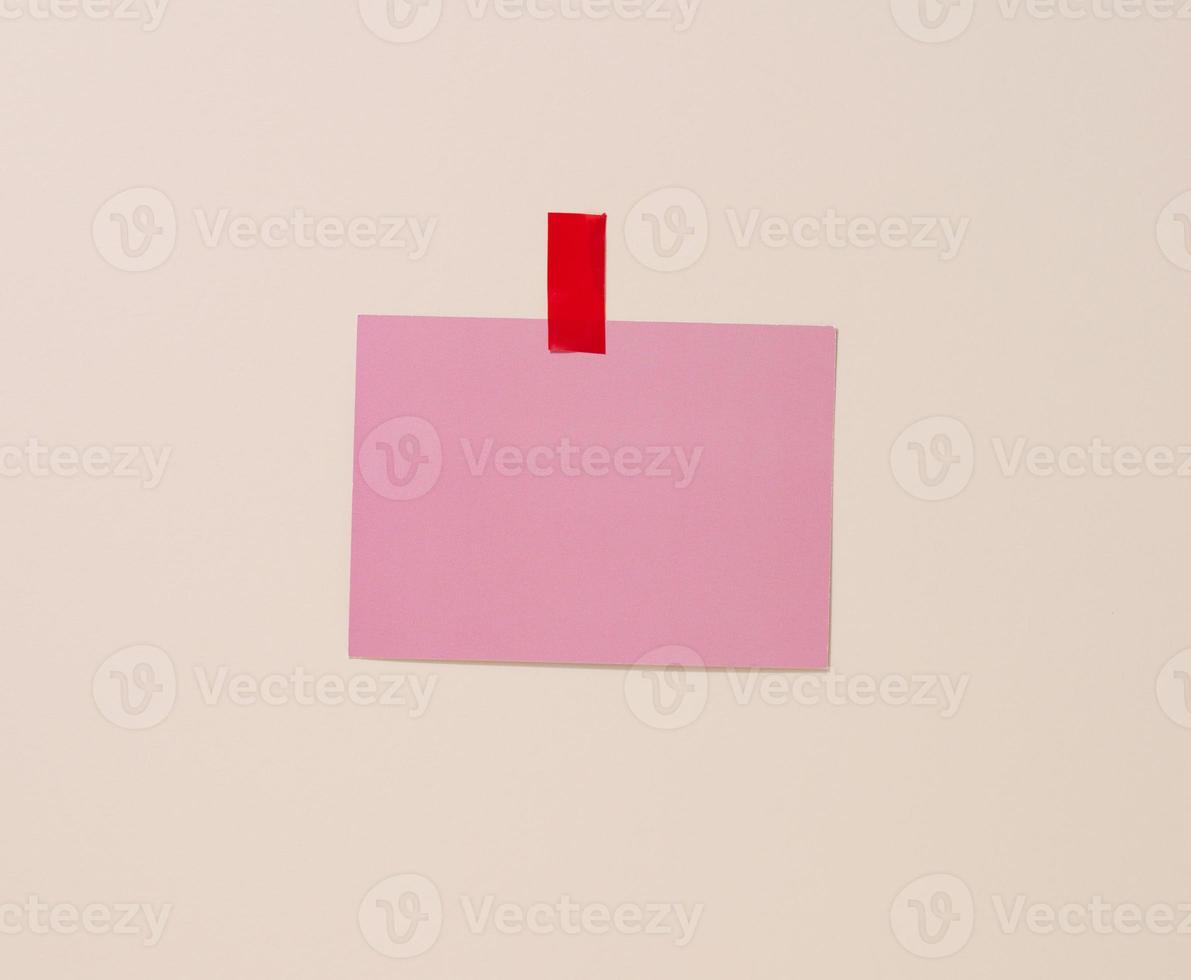 blank rectangular pink sheet of paper glued on a light blue background. Place for an inscription, announcement photo