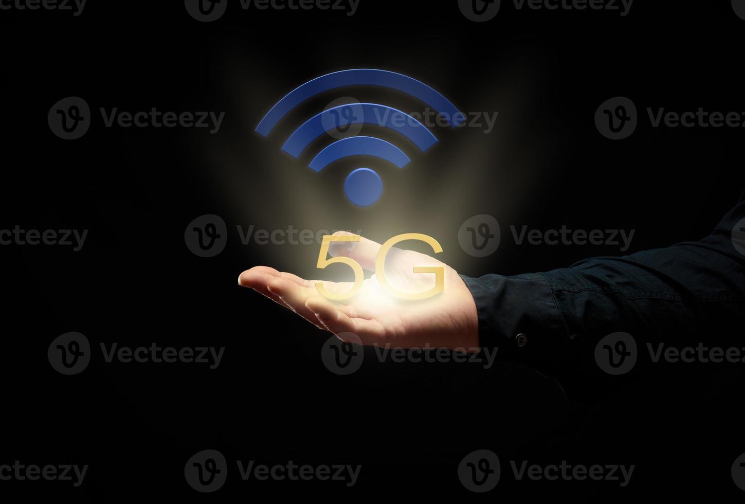 male hand on a black background and high-speed internet icon 5. Introduction of new modern technologies photo