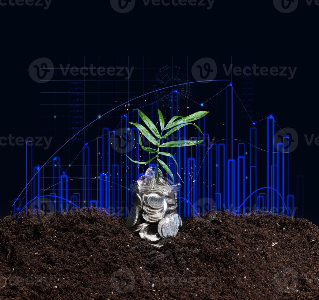 can of coins on the ground and a growing graph of indicators. Performance growth concept photo