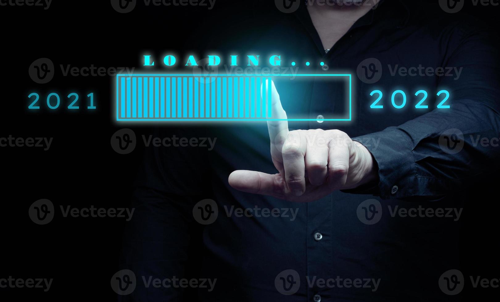 Download concept of new year 2022, man touches virtual hologram with download. The beginning of a new life, start up. Starting in business photo