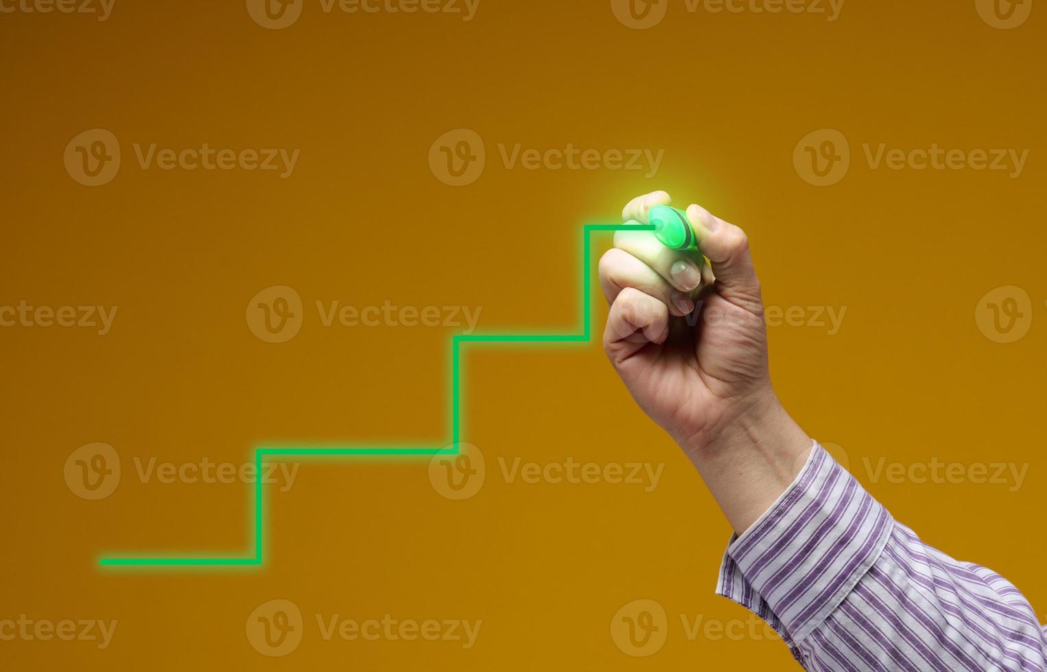 green steps drawn by a hand on a yellow background. Career growth, personal growth, starting a business photo
