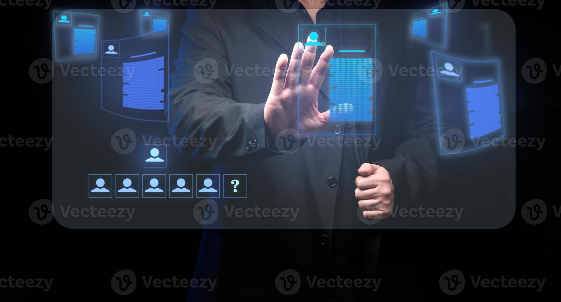 businessman standsaround a holographic screen with virtual resume. Selection of a candidate, search for a talented employee photo