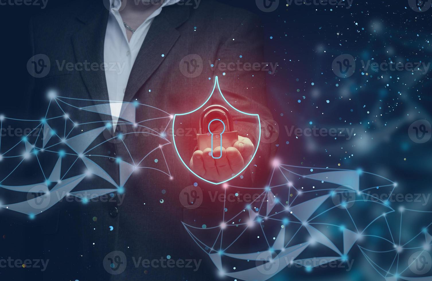 businessman in a suit holds a metal padlock on an abstract background of lines and dots. The concept of protecting personal data on the network, cyber security. Reliable data encryption photo