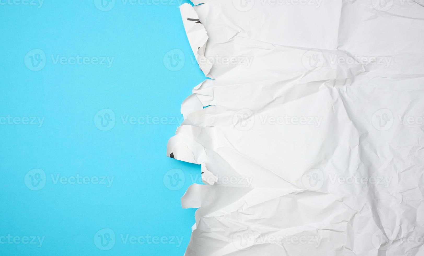 crumpled white paper with torn edges photo