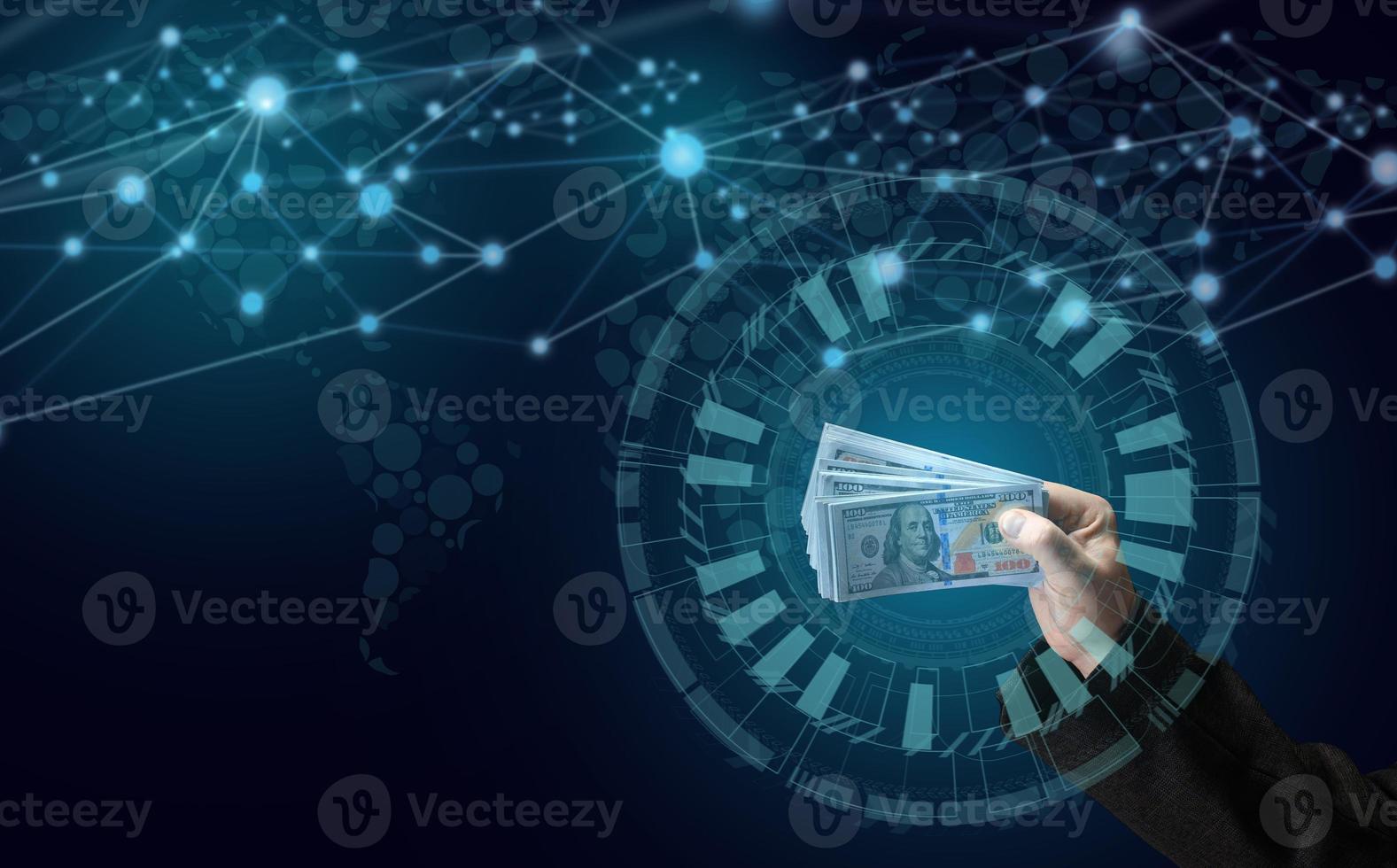 a man's hand holds a pack of paper american dollars on a dark blue background. Income growth concept, high margin in business photo
