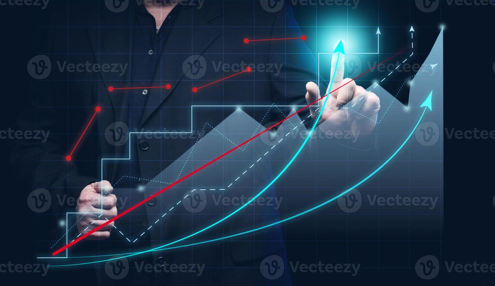 man in a black shirt stands in front of a holographic graph with growing indicators. Business growth, sales increase. High performance photo