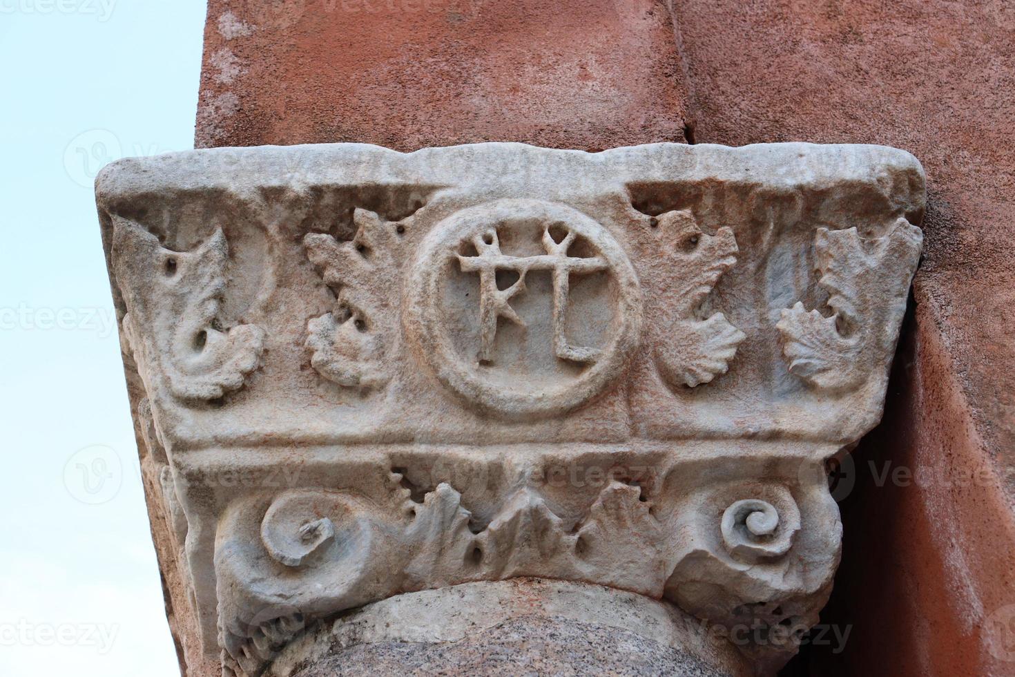 Close up vintage old pillar with vignetting in Venice, Italy. Mediterranean architecture. Street scene photo