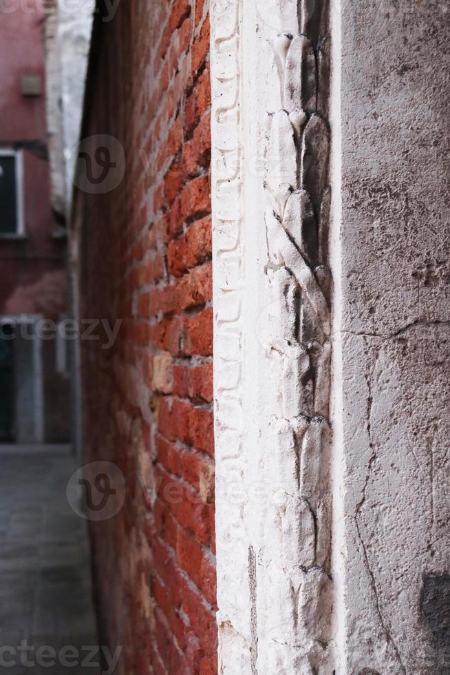 Close up view of the Fondamenta Tolentino street photo. Street scene, old wall. photo