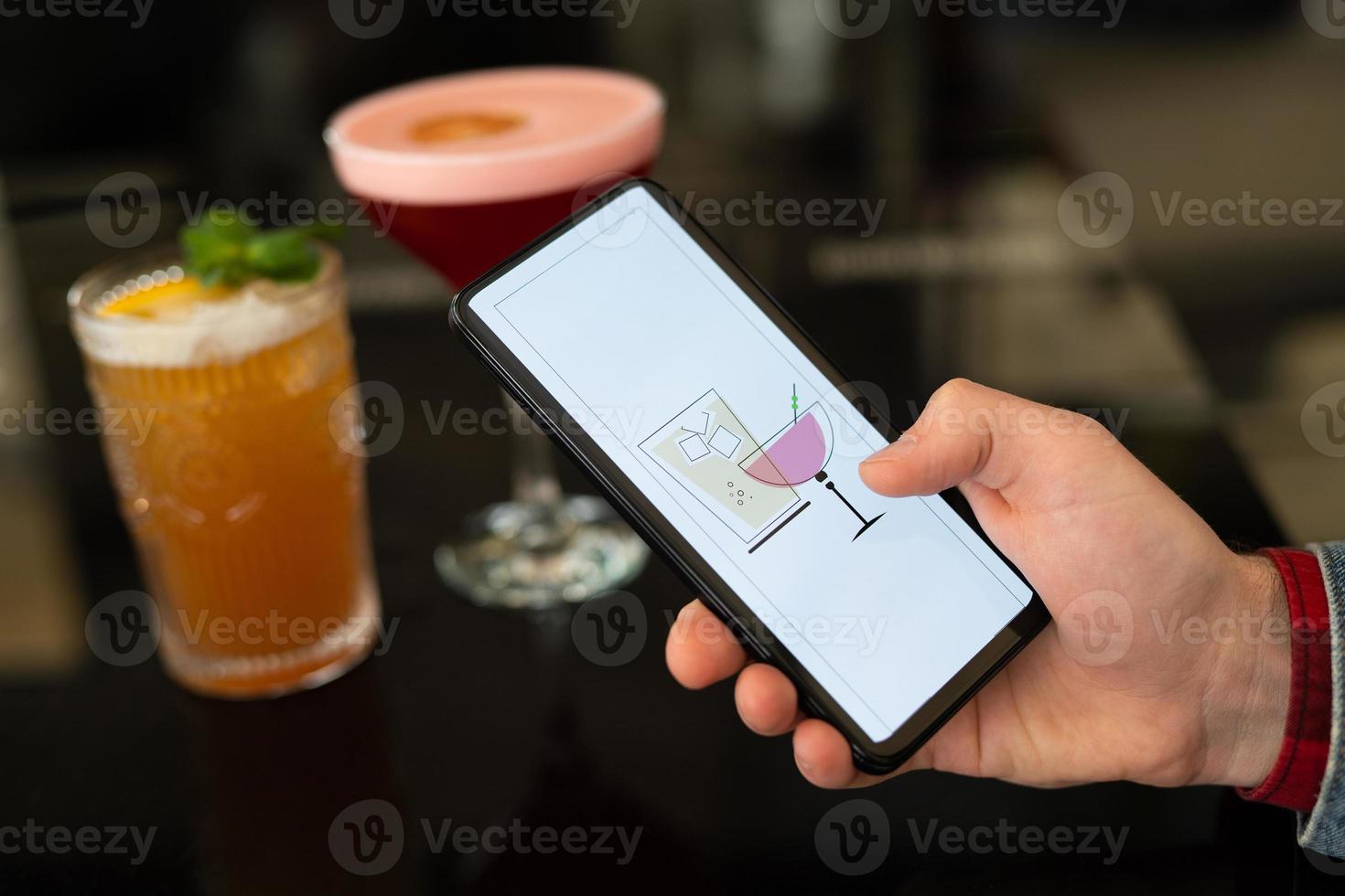 beautiful and delicious alcoholic cocktails prepared at the bar by the bartender. photo