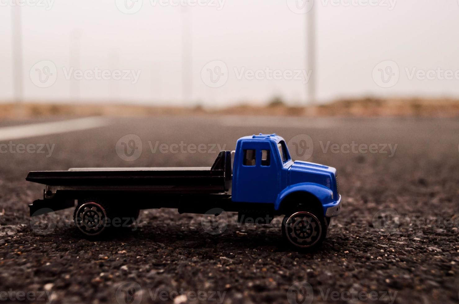 Toy truck on the road photo