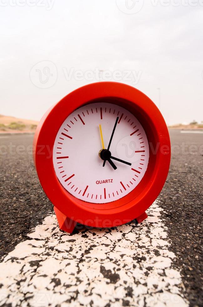 Clock on the road photo